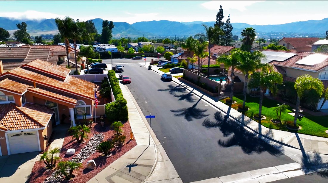 Aerial view along a suburban street