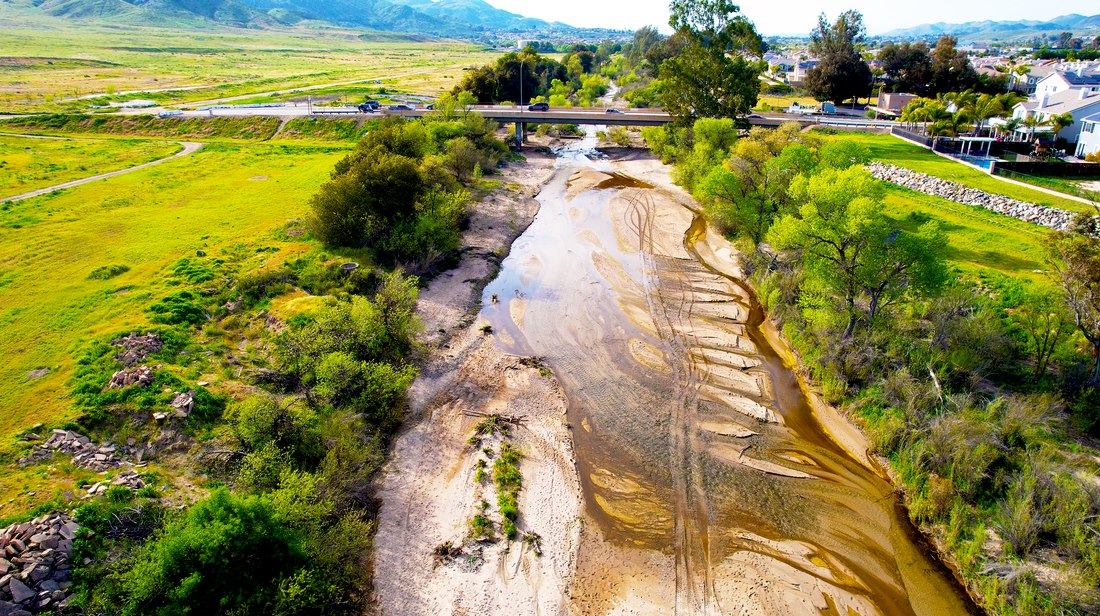 Aerial view along a river corridor